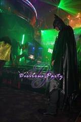 Batman perusing the dance floor at the party. 