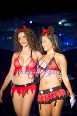 A sexy devil and minnie mouse walking the fashion show catwalk together at the Ritz.