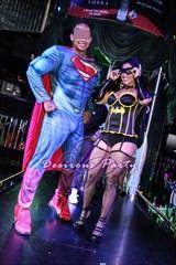 Superman and a Batgirl at the Halloween Erotica Ball in Houston. 