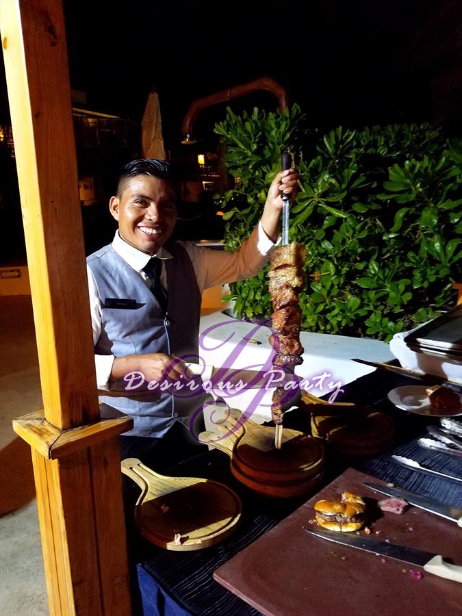 One of the waiters serving steak Brazilian steak house style at Desire Pearl. We ate very good all week. 