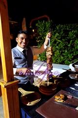 One of the waiters serving steak Brazilian steak house style at Desire Pearl. We ate very good all week. 