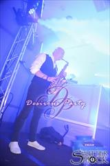 Jason Whitmore on saxophone on the Purgatory Grand Ballroom main stage. 